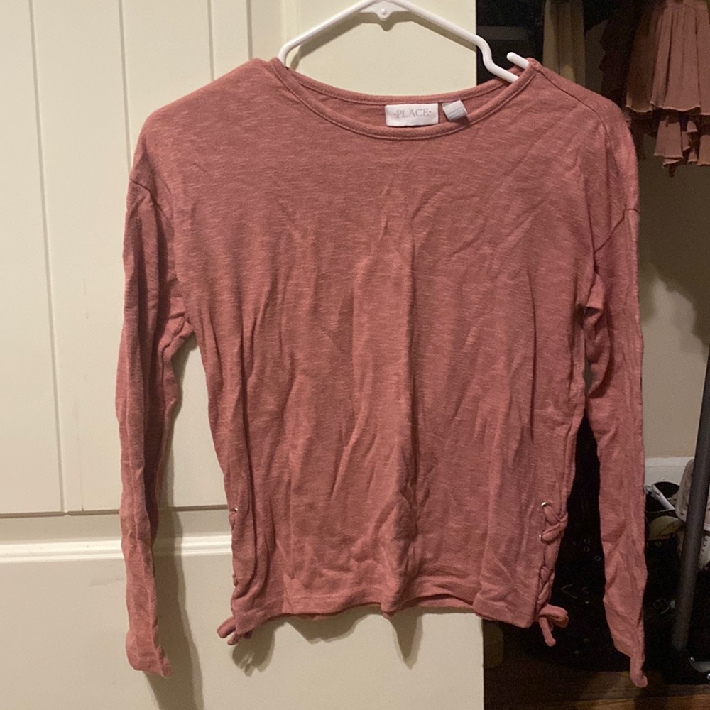 It is a pink Place long sleeve shirt with no signs of wear.